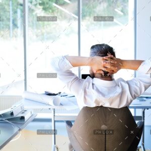 demo-attachment-31-Businessman-at-the-desk-in-his-office-resting.