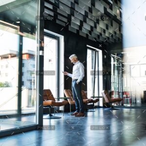 demo-attachment-34-Mature-businessman-with-smartphone-in-the-office.